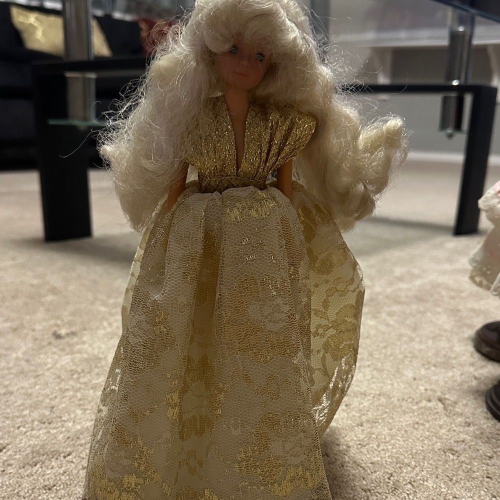 Elegant Gold and White Doll with Flowing Dress